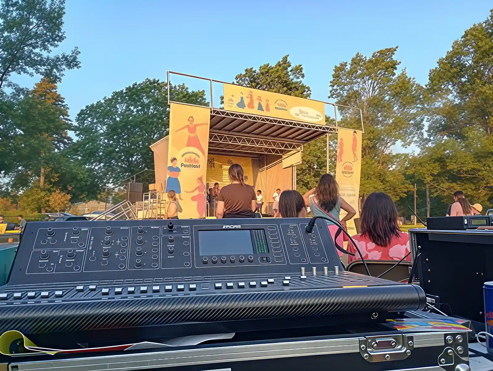 Sound engineer at a mixing board during a festival